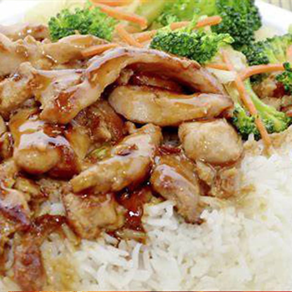 Glazed chicken with white rice and broccoli.